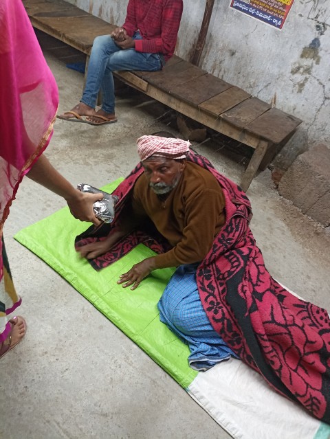 Volunteers stacking blankets in cart